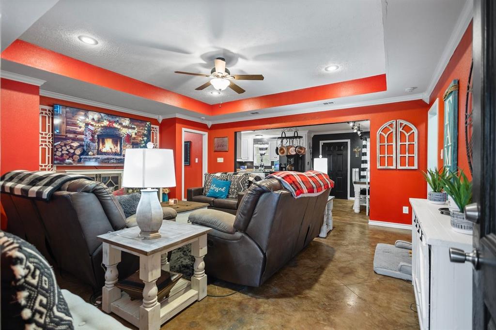 202 Spring Valley Queen City, TX 75572 - Photo 6 of 35 Cinema room with finished concrete floors, a raised ceiling, ceiling fan, crown molding, and recessed lighting