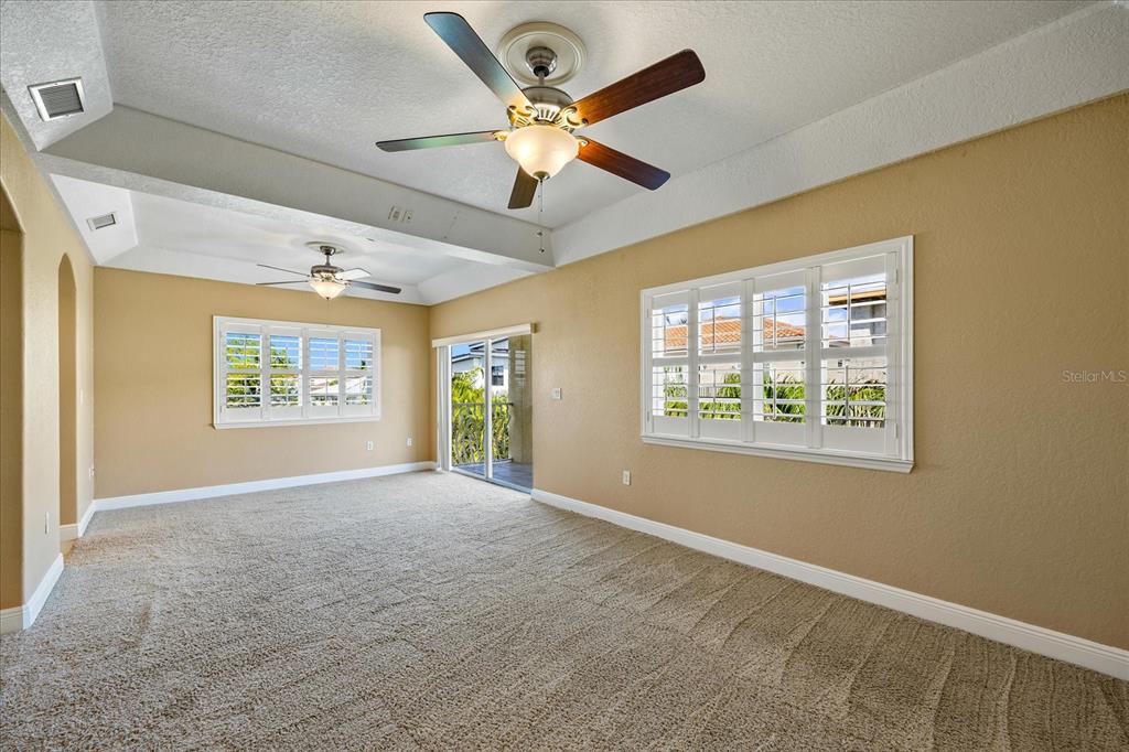 136 175th Avenue East Redington Shores, FL 33708 - Photo 13 of 40 a view of an empty room with a window