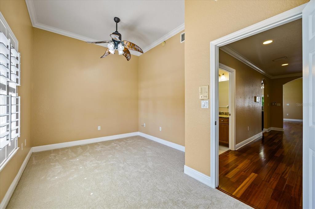 136 175th Avenue East Redington Shores, FL 33708 - Photo 22 of 40 an empty room and chandelier fan