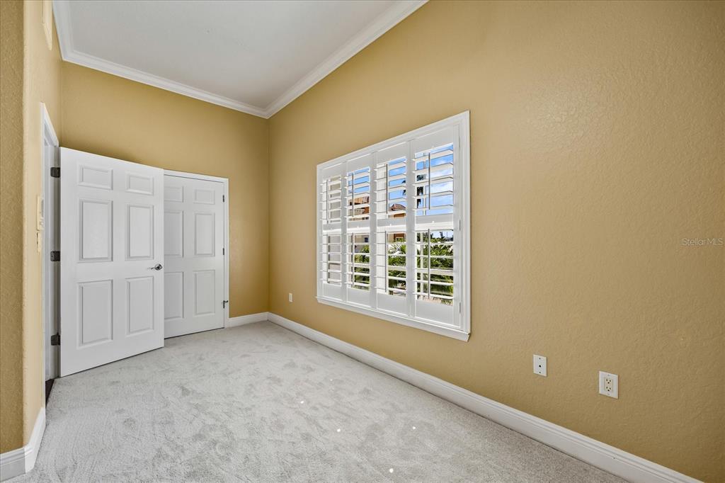 136 175th Avenue East Redington Shores, FL 33708 - Photo 23 of 40 a view of an empty room with a window