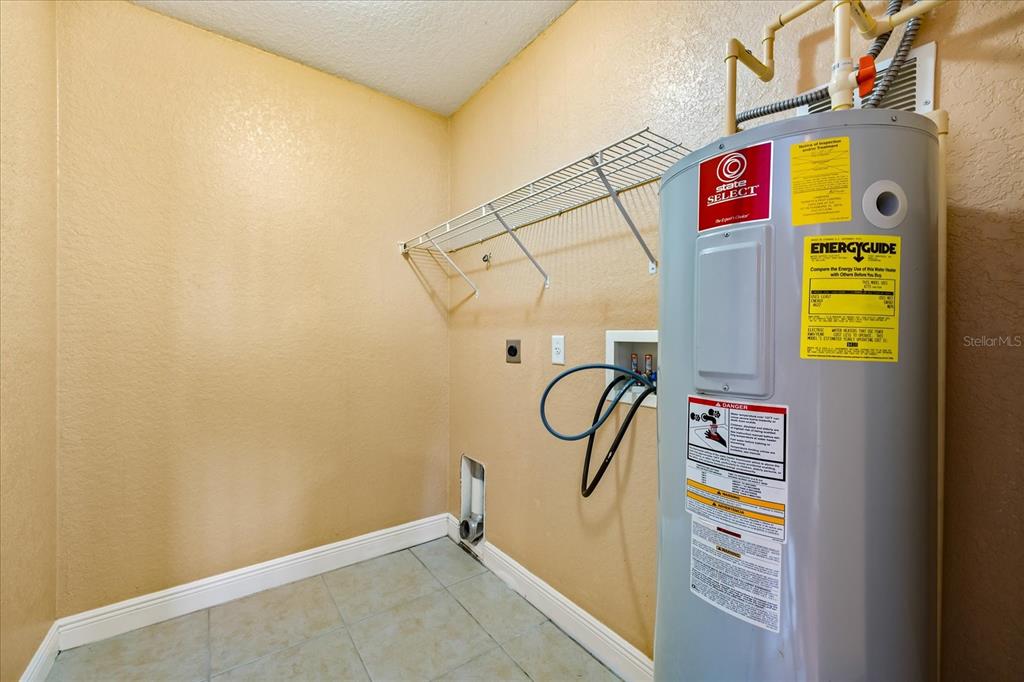 136 175th Avenue East Redington Shores, FL 33708 - Photo 26 of 40 a utility room with dryer and washer