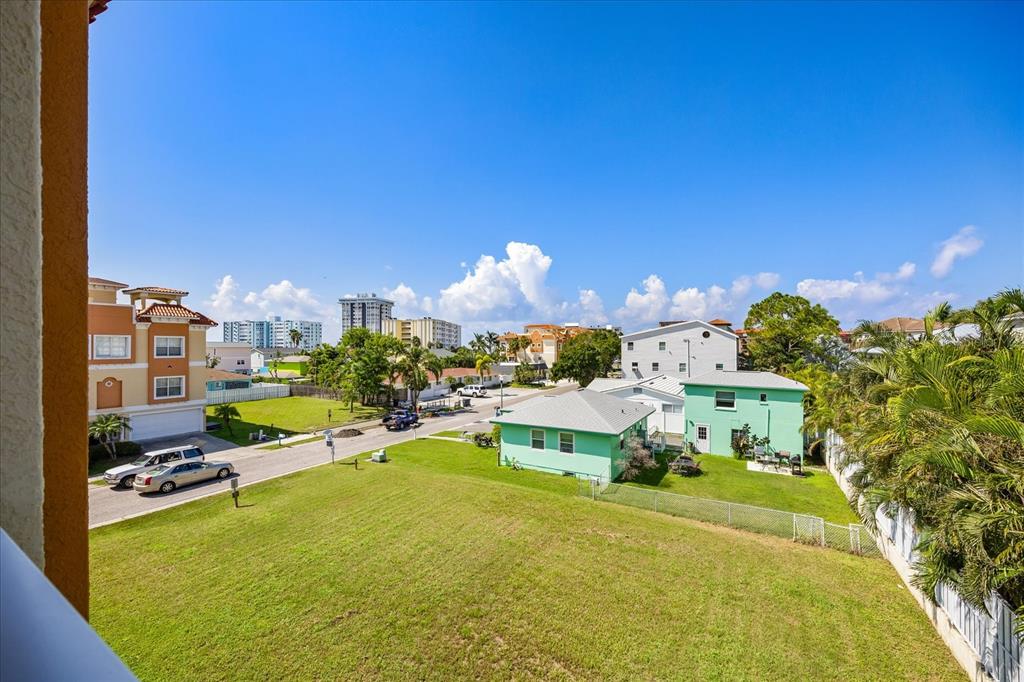 136 175th Avenue East Redington Shores, FL 33708 - Photo 36 of 40 a view of a swimming pool and lounge chairs