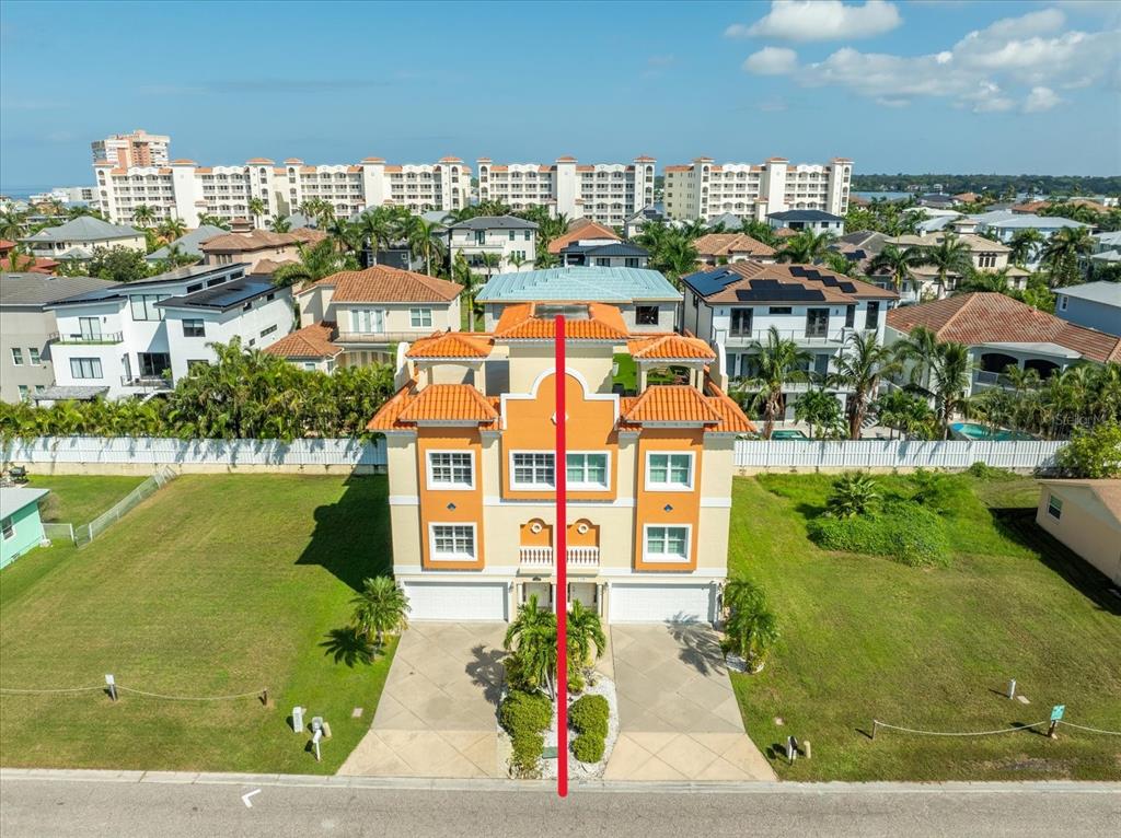 136 175th Avenue East Redington Shores, FL 33708 - Photo 4 of 40 a aerial view of multiple houses with yard