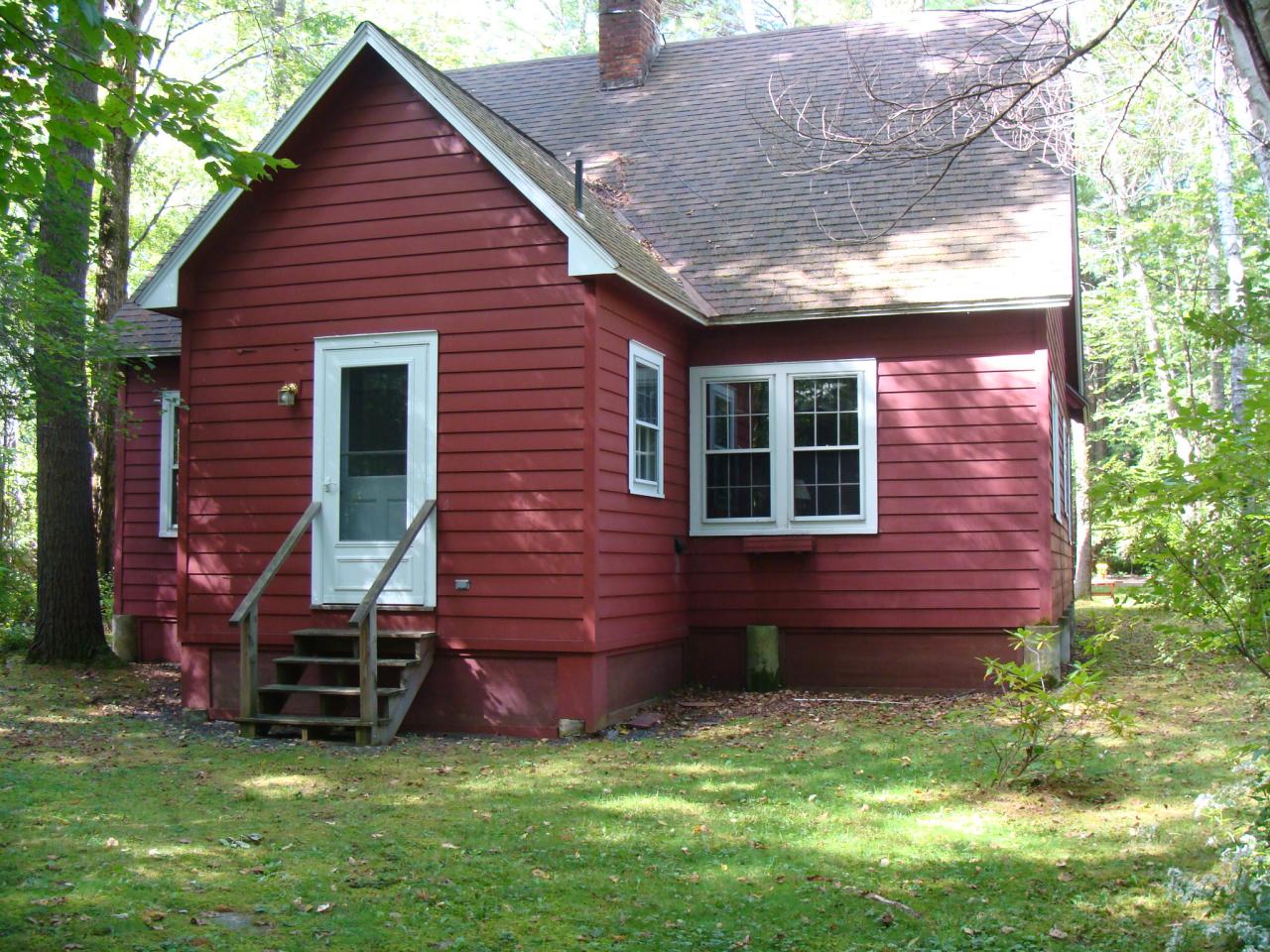 4 Grove Road Stockbridge, MA 01262 - Photo 2 of 16 a view of a brick house with a yard