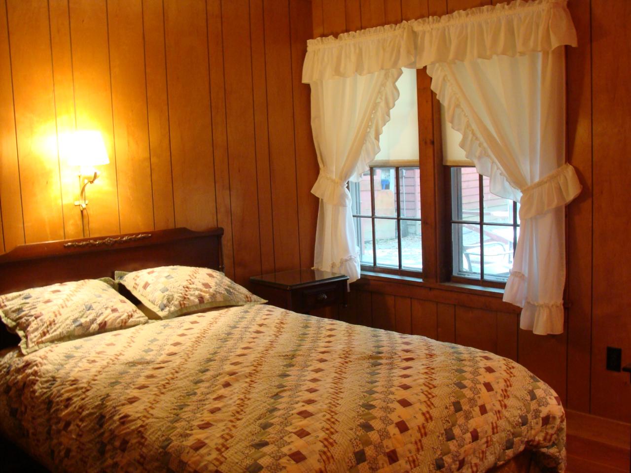 4 Grove Road Stockbridge, MA 01262 - Photo 13 of 16 a bedroom with a bed and a window