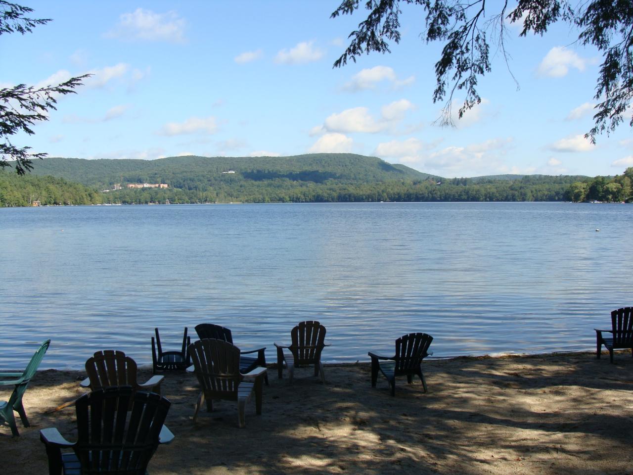4 Grove Road Stockbridge, MA 01262 - Photo 5 of 16 a lake view with a table and chairs