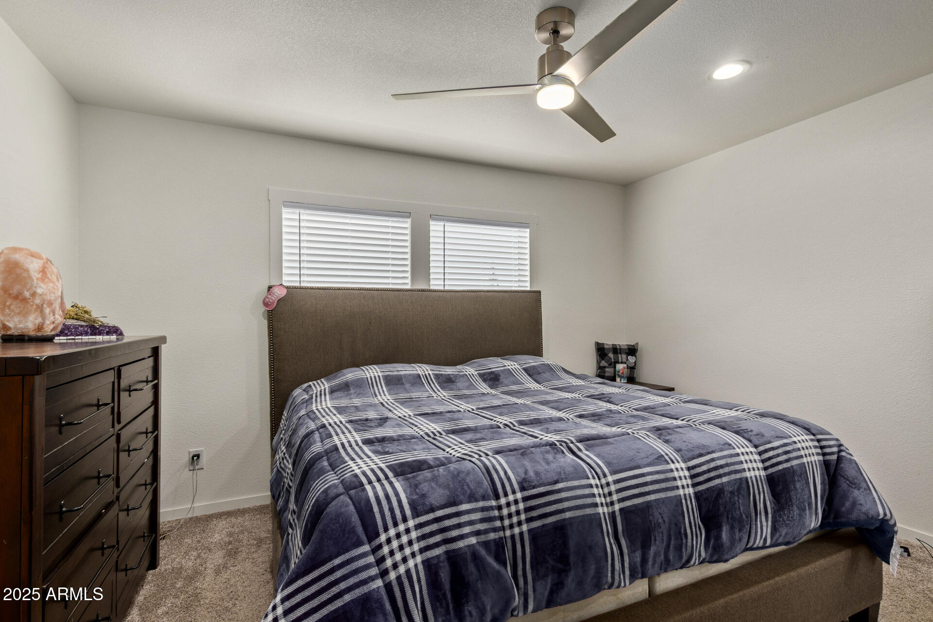 501 East Ray Road, Unit 201 Chandler, AZ 85225 - Photo 10 of 28 a bed sitting in a bedroom next to a window