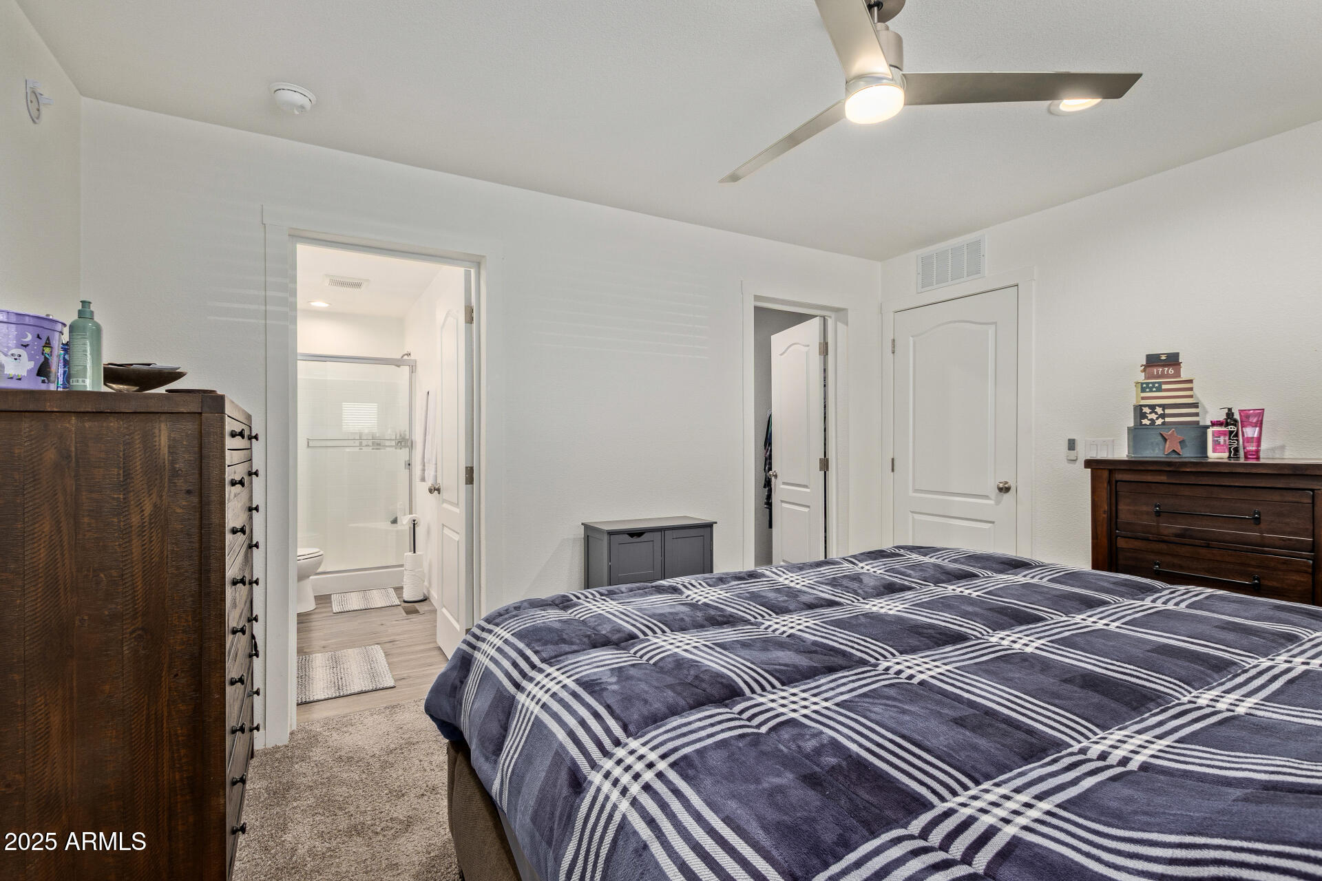 501 East Ray Road, Unit 201 Chandler, AZ 85225 - Photo 11 of 28 a bedroom with a bed and a dresser