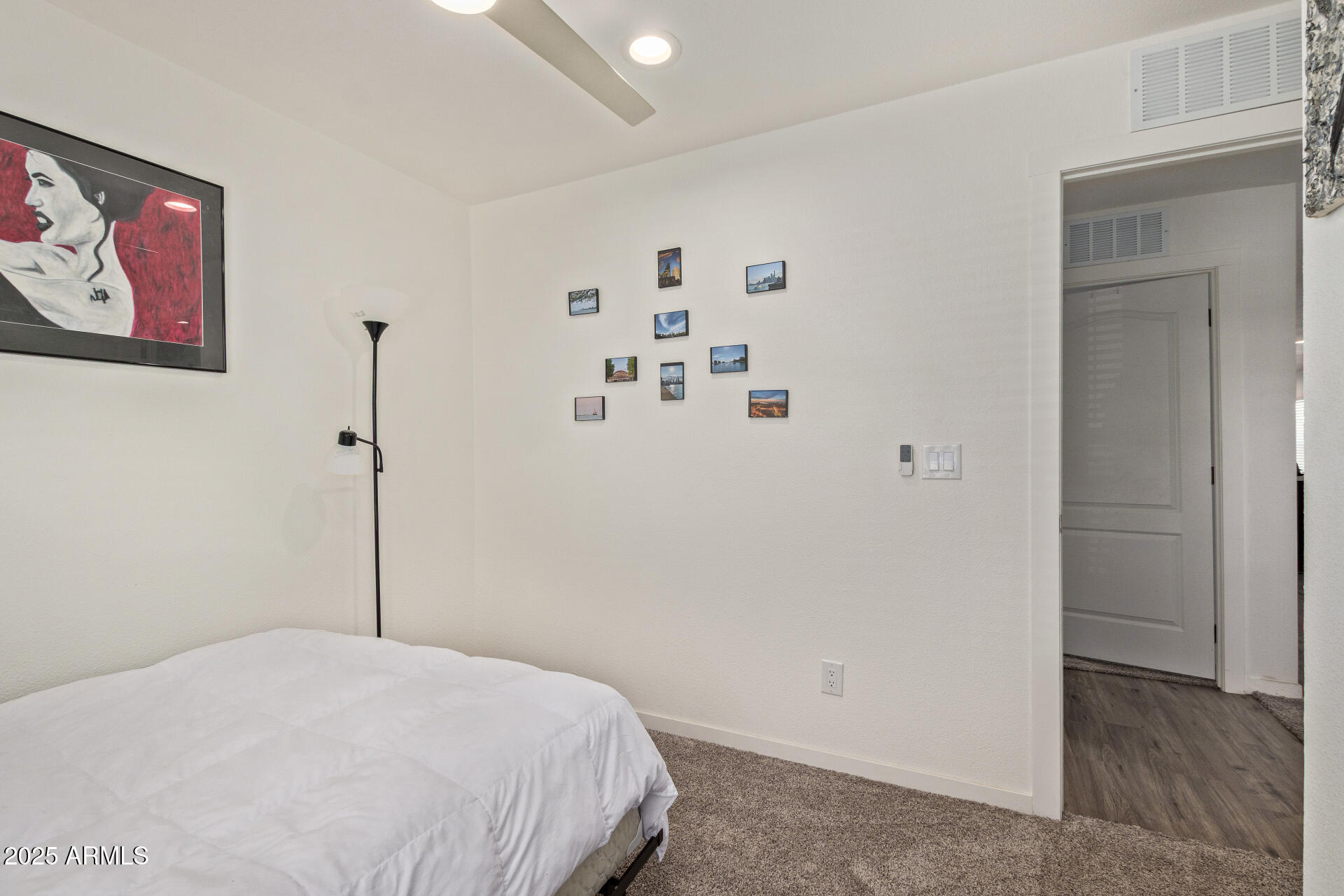 501 East Ray Road, Unit 201 Chandler, AZ 85225 - Photo 16 of 28 a bedroom with a bed and a refrigerator