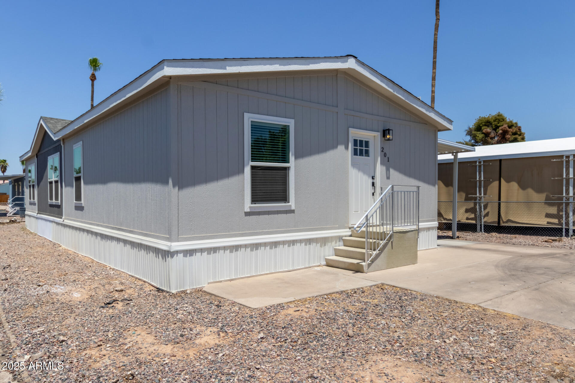 501 East Ray Road, Unit 201 Chandler, AZ 85225 - Photo 19 of 28 a front view of a house with a glass door