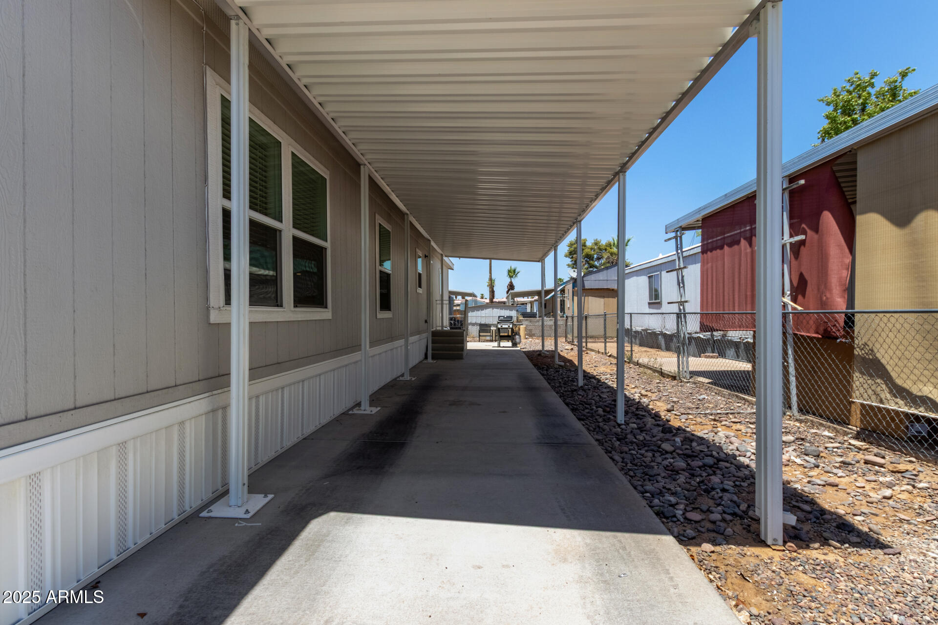 501 East Ray Road, Unit 201 Chandler, AZ 85225 - Photo 21 of 28 a view of a porch with wooden floor and stairs