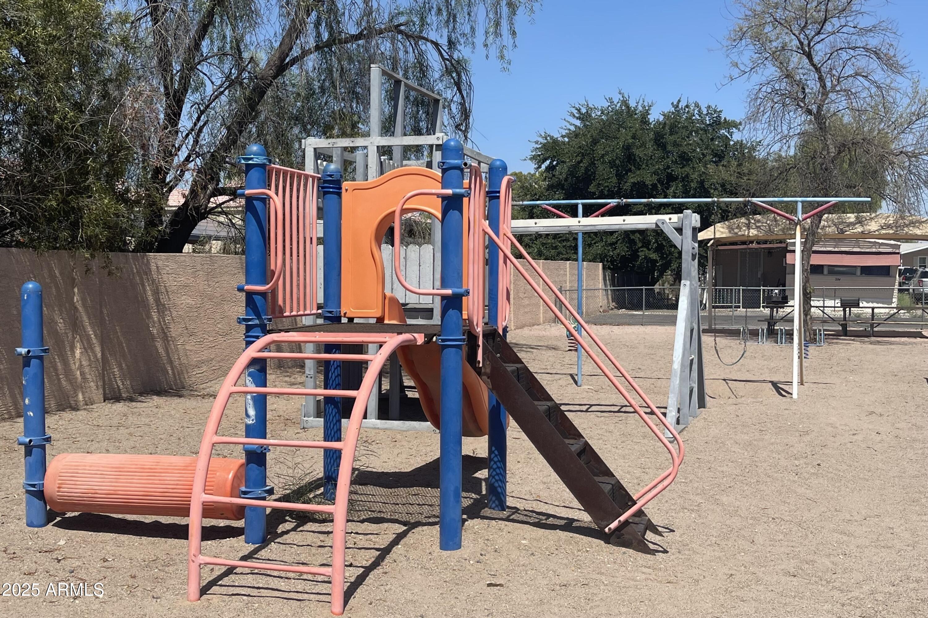 501 East Ray Road, Unit 201 Chandler, AZ 85225 - Photo 24 of 28 a view of a chairs with wooden fence