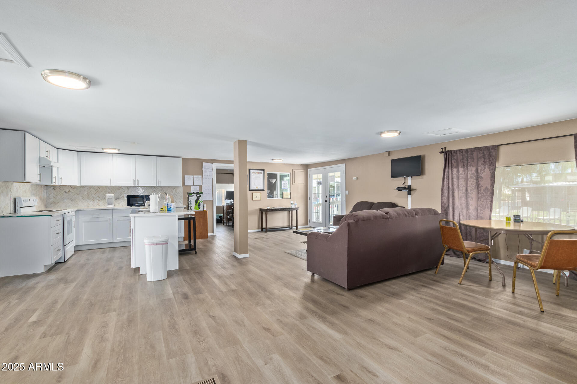 501 East Ray Road, Unit 201 Chandler, AZ 85225 - Photo 27 of 28 a living room with furniture and a wooden floor