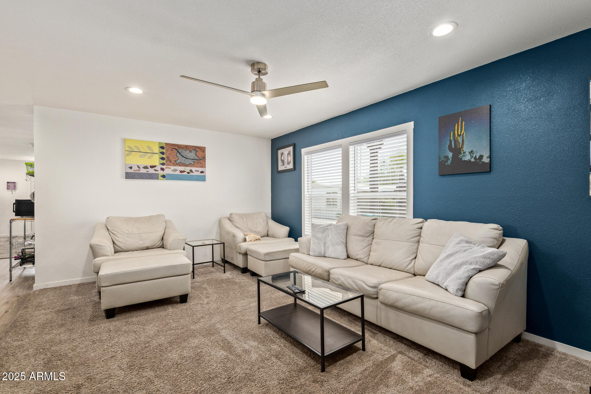 501 East Ray Road, Unit 201 Chandler, AZ 85225 - Photo 3 of 28 a living room with furniture and a large window