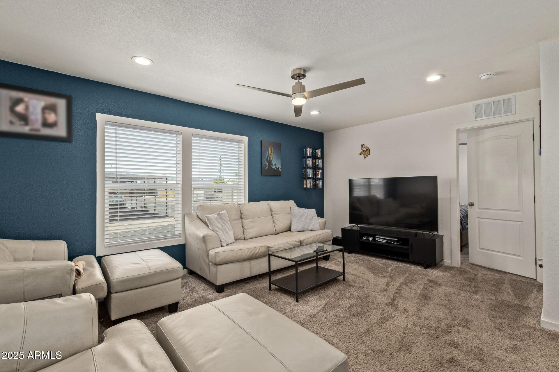 501 East Ray Road, Unit 201 Chandler, AZ 85225 - Photo 4 of 28 a living room with furniture and a flat screen tv