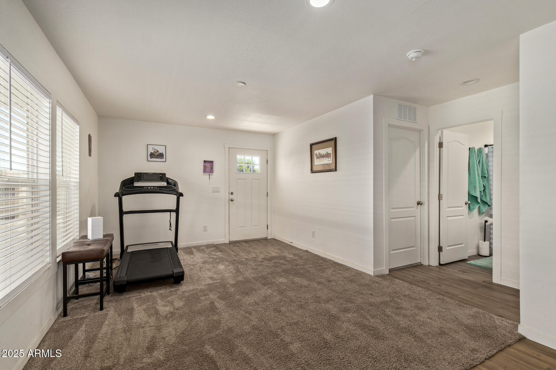 501 East Ray Road, Unit 201 Chandler, AZ 85225 - Photo 8 of 28 a view of a livingroom with furniture and windows