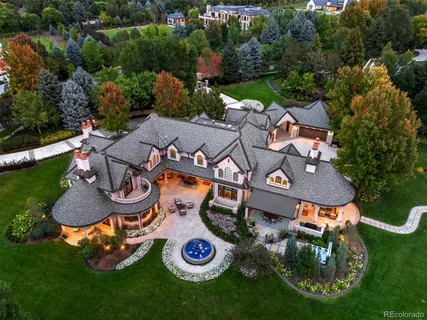 an aerial view of a house with outdoor space