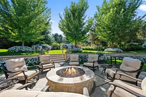 a view of a chairs and table in patio