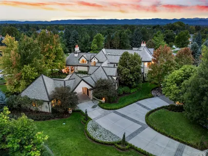 an aerial view of a house with garden space and street view