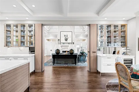 a living room with furniture wooden floor and a fireplace