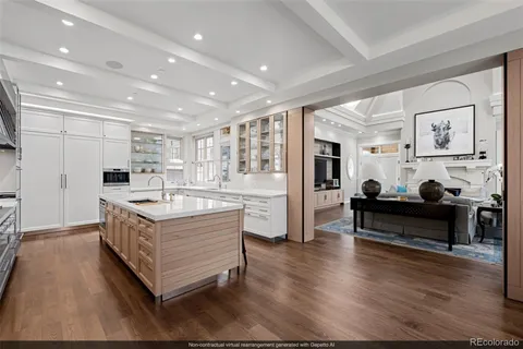 a large white kitchen with a large window