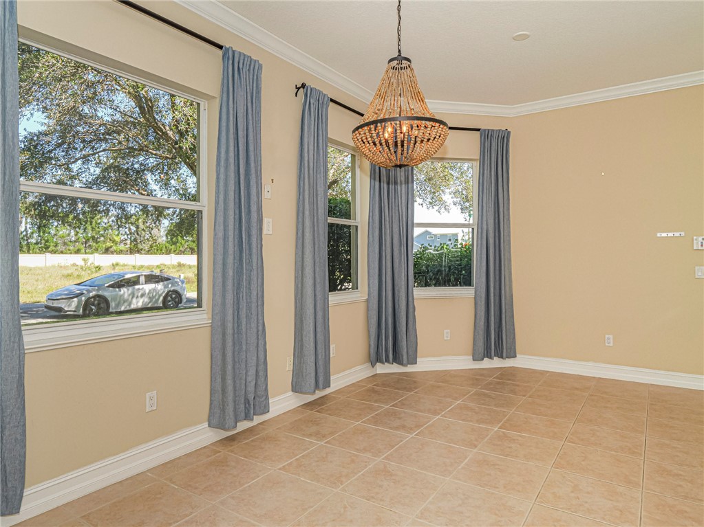 1965 Bridgepointe Circle, Unit 84 Vero Beach, FL 32967 - Photo 13 of 33 a view of a chandelier in a room
