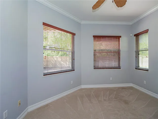 an empty room with closet area