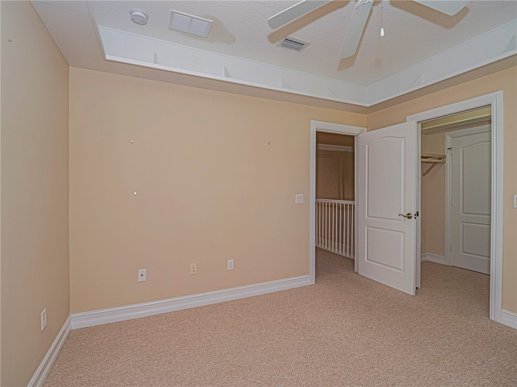 1965 Bridgepointe Circle, Unit 84 Vero Beach, FL 32967 - Photo 24 of 33 an empty room with closet area