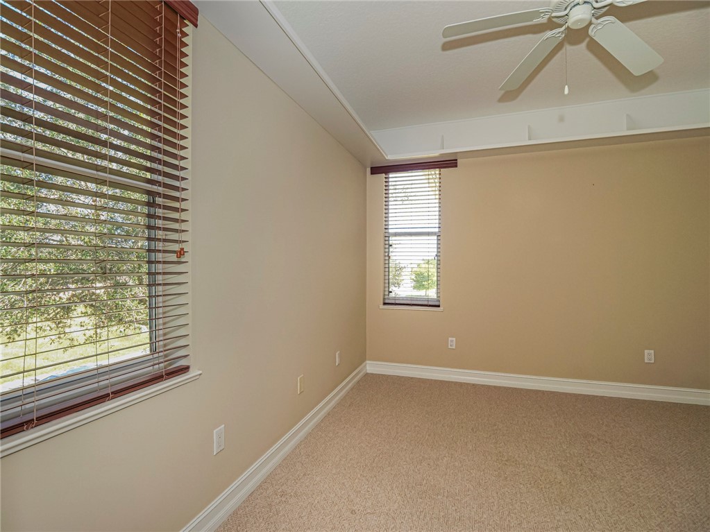 1965 Bridgepointe Circle, Unit 84 Vero Beach, FL 32967 - Photo 25 of 33 a view of room with window and a ceiling fan