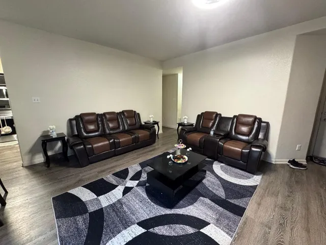 a living room with furniture rug and couch