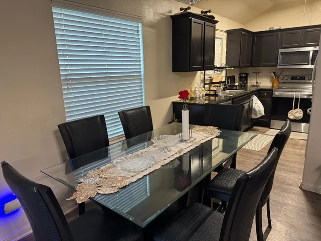 a view of a dining room with furniture