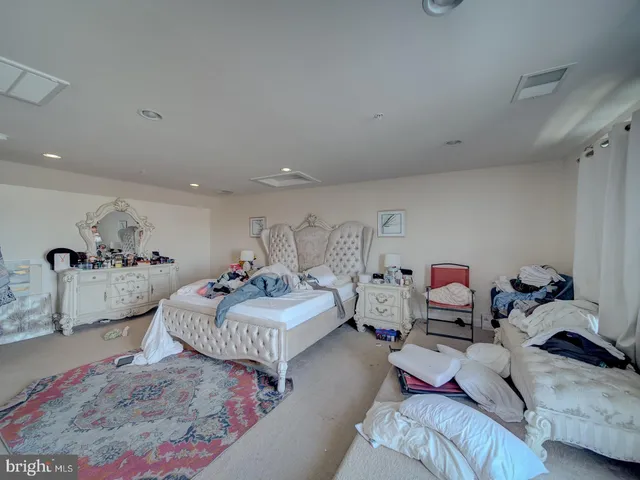 a bedroom with furniture and a couch