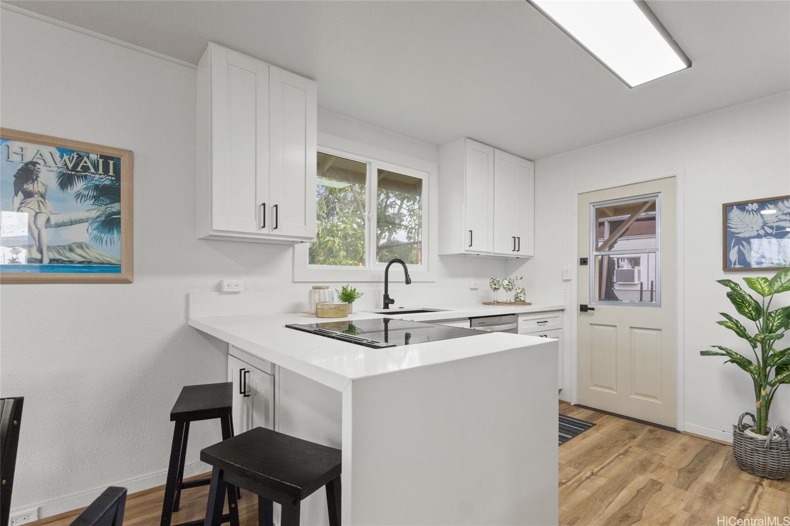 91-433 Ewa Beach Road Ewa Beach, HI 96706 - Photo 20 of 22 a kitchen with a sink cabinets and window