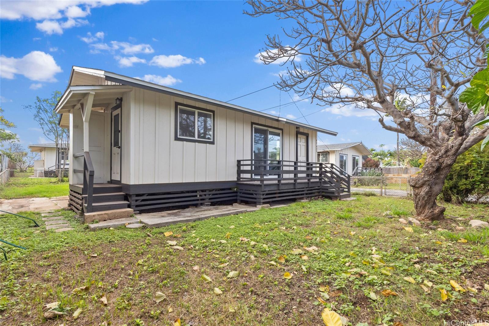 91-433 Ewa Beach Road Ewa Beach, HI 96706 - Photo 22 of 22 a view of a house with backyard and sitting area