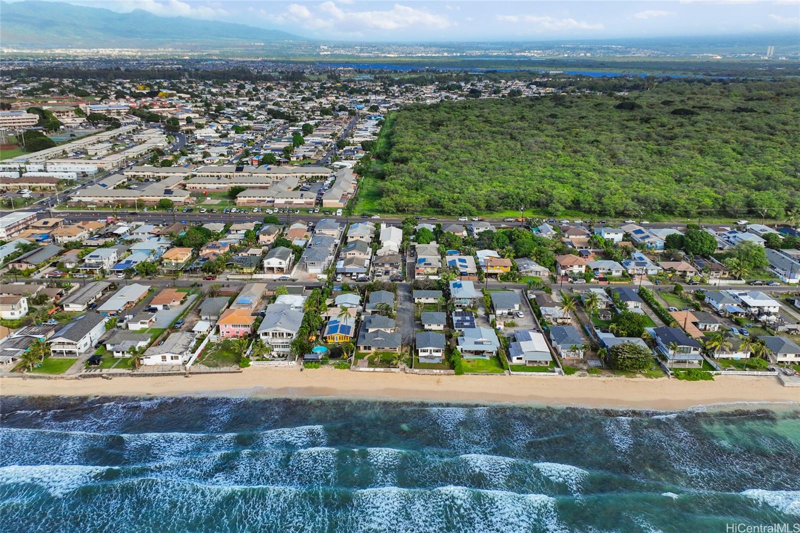91-433 Ewa Beach Road Ewa Beach, HI 96706 - Photo 8 of 22 an aerial view of residential houses with outdoor space and trees