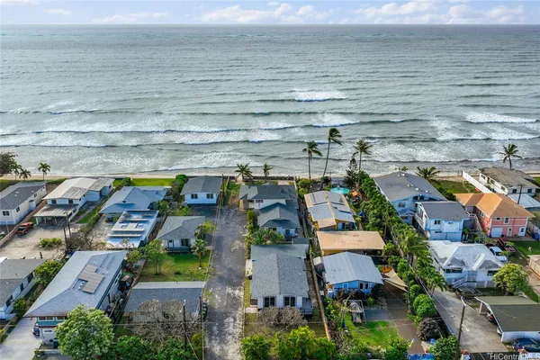 an aerial view of houses with outdoor space