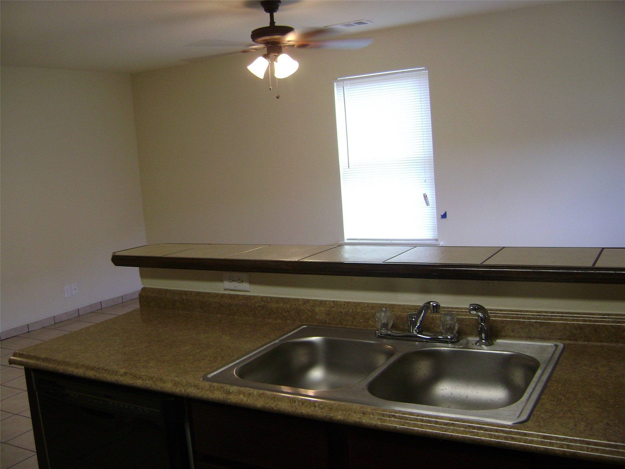 2507 Oak Lane, Unit A Georgetown, TX 78628 - Photo 5 of 11 A functional kitchen sink and countertop are ready for daily use.