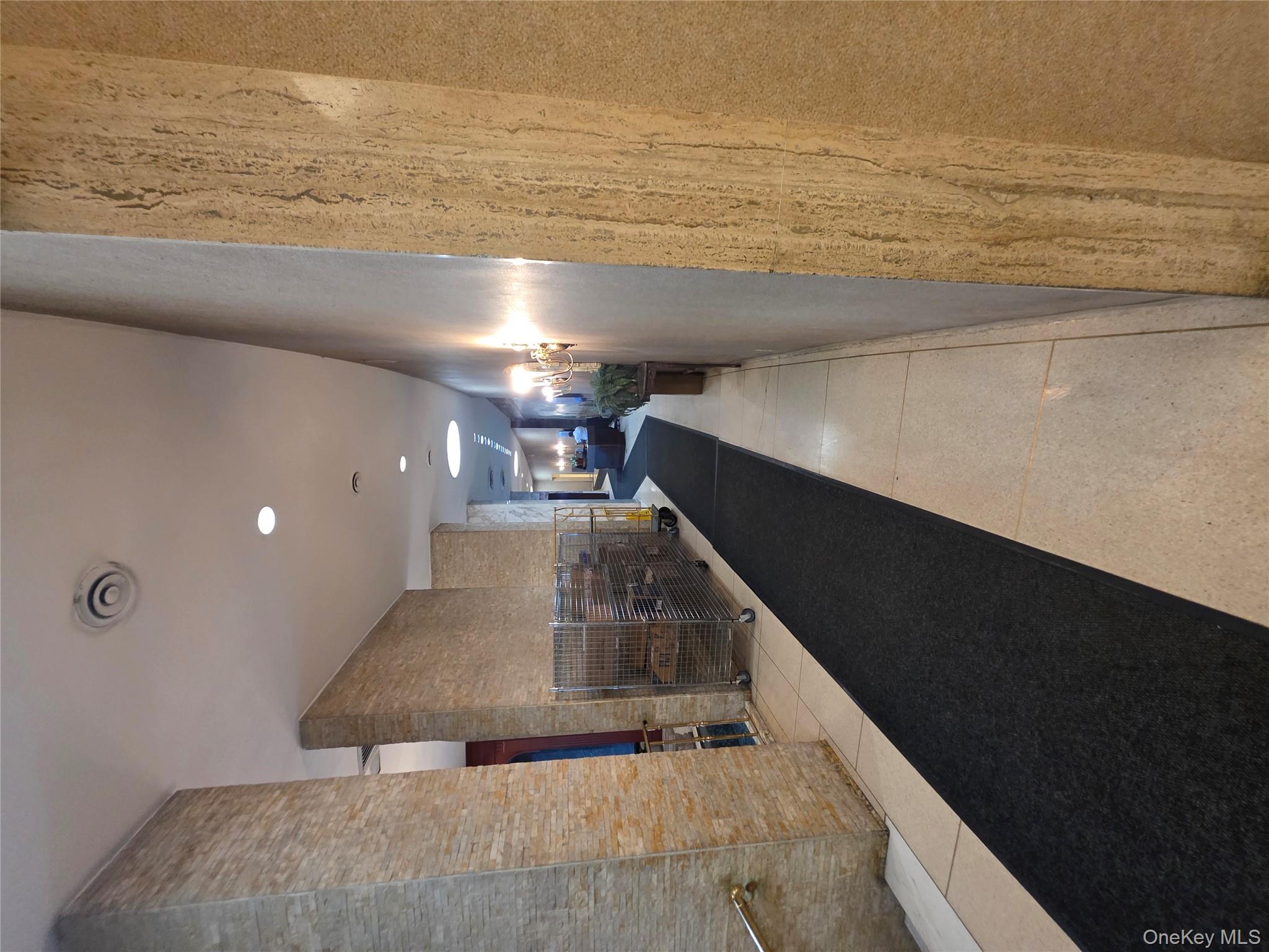 1020 Grand Concourse, Unit 17M Bronx, NY 10451 - Photo 16 of 20 a view of a hallway with wooden floor
