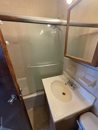 a bathroom with a sink and a shower