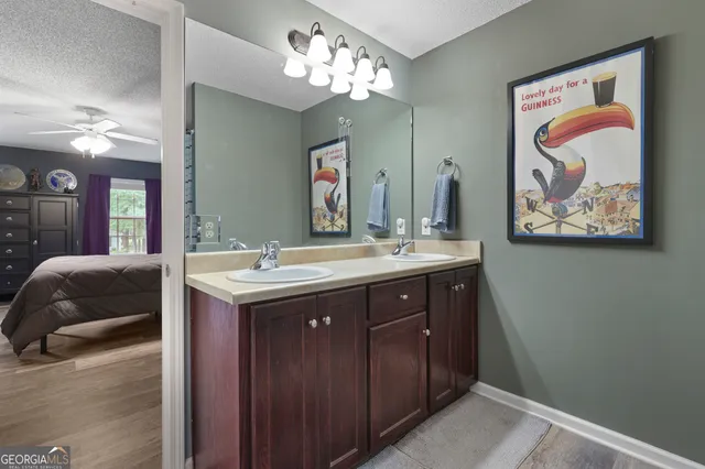 a bathroom with a double vanity sink and a mirror
