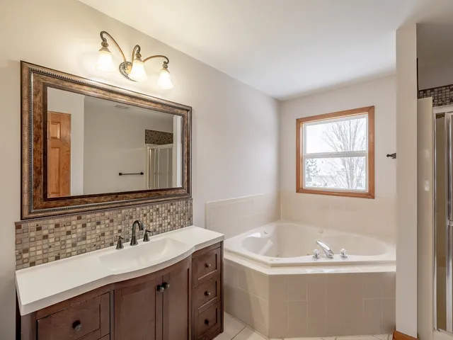 a bathroom with a bathtub and a sink