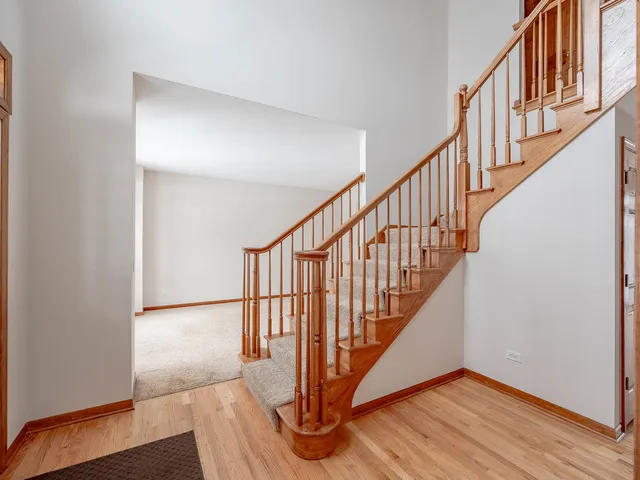 a view of an entryway with wooden floor