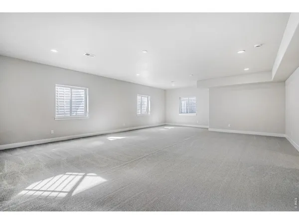 a view of empty room with windows