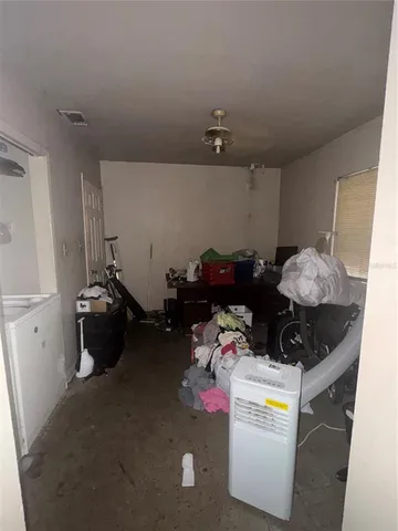 a bedroom with a bed and cabinets