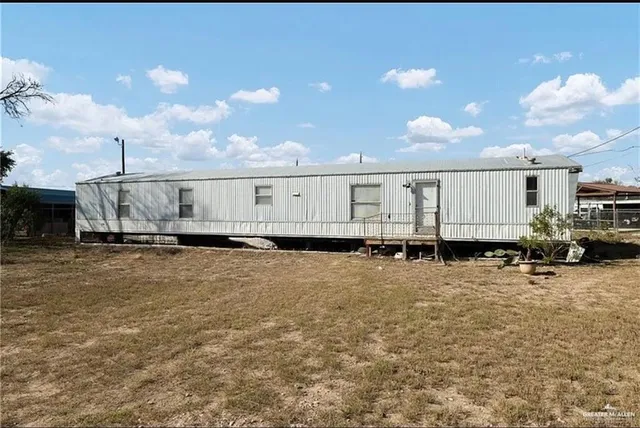 a view of a back yard of the house