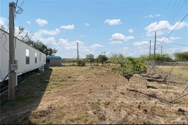 a view of swimming pool with a yard