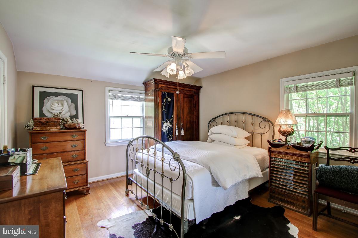 312 Waterford Road Silver Spring, MD 20901 - Photo 14 of 29 a bedroom with a bed and wooden floor