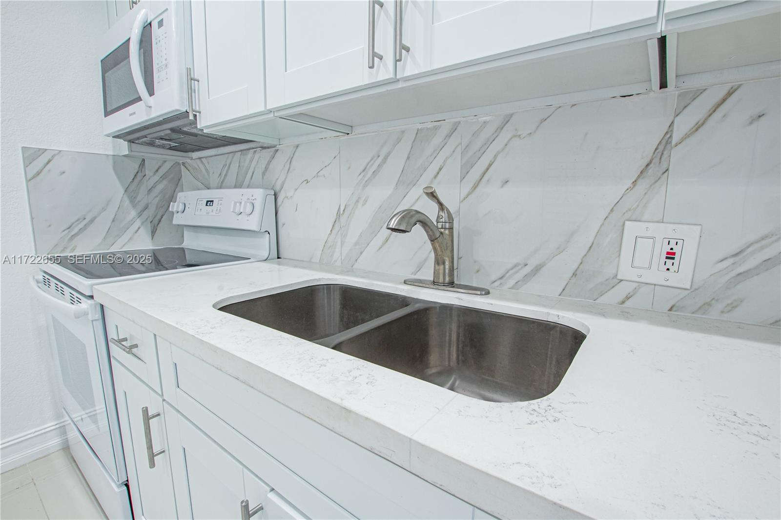 575 Northwest 49th Street Miami, FL 33127 - Photo 3 of 22 a close view of sink and tap