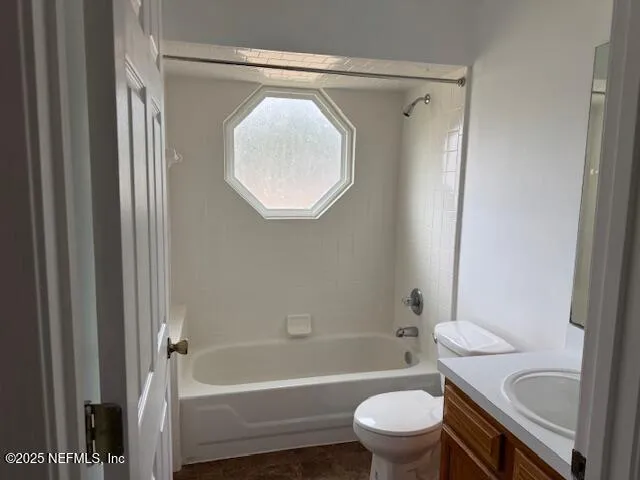 a bathroom with a toilet and a bathtub