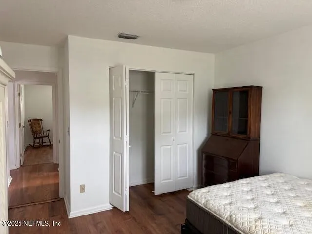 a kitchen with a refrigerator and a stove top oven